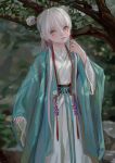 1girl black_sash blue_ribbon blurry blurry_background branch chinese_clothes closed_mouth depth_of_field double_bun facial_mark fkey green_eyes grey_hair hand_up highres long_hair long_sleeves looking_at_viewer original outdoors ribbon sash sleeves_past_wrists solo tree under_tree 