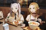  2girls absurdres alternate_costume blonde_hair braid chopsticks crossover dungeon_meshi eating elf food frieren green_eyes highres holding holding_chopsticks indoors long_hair looking_at_another marcille_donato multiple_girls noodles pointy_ears ramen senegalus_c sitting smile sousou_no_frieren spoon twin_braids twintails white_hair 