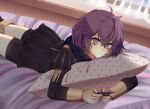  1girl :t bernadetta_von_varley black_skirt closed_mouth commentary controller curtains eine_(eine_dx) english_commentary eyebrows_visible_through_hair fire_emblem fire_emblem:_three_houses garreg_mach_monastery_uniform grey_eyes highres holding holding_controller indoors joy-con long_sleeves lying messy_hair object_hug on_bed on_stomach pillow pillow_hug polka_dot_pillow purple_hair short_hair shorts shorts_under_skirt skirt solo window 