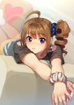  1girl ahoge arms_up bangs black_shirt blue_scrunchie blurry brown_hair closed_mouth commentary couch drill_hair eyebrows_visible_through_hair frown hair_ornament hair_scrunchie heart idolmaster idolmaster_million_live! kamille_(vcx68) looking_at_viewer lying medium_hair on_couch on_stomach orange_pants pants pillow print_scrunchie purple_eyes scrunchie shirt short_sleeves side_drill side_ponytail solo star_(symbol) star_print t-shirt white_scrunchie wrist_scrunchie yokoyama_nao 