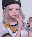  1girl bandaid bandaid_on_hand beanie black_headwear breasts chain collarbone earrings face forehead hands hat highres holding hoop_earrings jewelry keychain lips mano_aaa medium_breasts mole mole_under_eye orange_nails original parted_lips portrait ring rubber_duck shirt solo white_shirt 