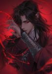  1boy arm_up black_hair black_nails blood bracer commentary english_commentary eyelashes fingernails gem hair_over_one_eye highres hua_cheng jewelry lisa_buijteweg long_hair long_sleeves looking_at_viewer male_focus necklace pointy_ears red_eyes ring sharp_fingernails tian_guan_ci_fu upper_body wind 