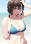  1girl arm_behind_back beach bikini blue_bikini blue_eyes blurry blurry_background blush breasts brown_hair closed_mouth depth_of_field hair_between_eyes hand_in_hair jonsun large_breasts looking_at_viewer medium_hair mole mole_under_eye navel original outdoors smile solo sweat swimsuit tamami_(jonsun) upper_body 