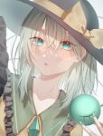  1girl :o absurdres aqua_eyes aqua_nails blurry blush bow commentary depth_of_field face green_hair hair_between_eyes hat hat_bow highres hisu_(hisu_) komeiji_koishi long_hair looking_at_viewer nail_polish parted_lips shirt simple_background solo third_eye touhou upper_body white_background yellow_shirt 