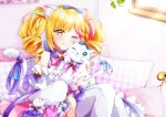  1girl animal animal_ear_fluff animal_ears bangs blonde_hair blush bow cat cat_ears cat_girl dress english_commentary frilled_dress frills hair_bow holding holding_animal holding_cat looking_at_viewer lumilive nota_ika off-shoulder_dress off_shoulder one_eye_closed purple_bow smile solo tail tail_bow tail_ornament thighhighs tsukigami_yui twintails virtual_youtuber white_dress yellow_eyes 