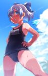  1girl bare_arms bare_legs bare_shoulders black_swimsuit blue_bow blue_eyes blue_hair blush bow cirno collarbone day eyebrows_visible_through_hair fairy grin hair_between_eyes hair_bow hands_on_hips ice ice_wings name_tag nooca one-piece_swimsuit school_uniform short_hair smile solo swimsuit tan tanlines touhou wings 