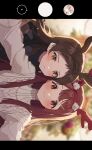  2girls absurdres antlers beige_sweater blurry blurry_background blush brown_hair depth_of_field hano9789 highres idolmaster idolmaster_million_live! kitazawa_shiho lens_flare light_smile looking_at_viewer multiple_girls phone_screen red_eyes reindeer_antlers selfie sideways straight_hair taking_picture tanaka_kotoha 