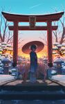  1girl absurdres blue_kimono highres holding holding_umbrella japanese_clothes kimono obi oil-paper_umbrella original pasoputi print_kimono red_umbrella sash sky snow solo standing sunset tiger torii tree umbrella 