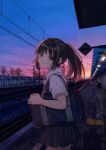  1girl akr_tmr bag black_hair looking_at_viewer original outdoors ponytail railroad_tracks school_bag school_uniform smile solo sunset 