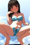  1girl bangs bare_legs barefoot bikini black_hair blue_bikini blush bow bow_bikini bracelet breasts brown_eyes cloud collarbone commentary_request eyebrows_visible_through_hair full_body highres jewelry long_hair looking_at_viewer matsunaga_kouyou navel nose_blush original outdoors polka_dot polka_dot_bikini sky small_breasts smile solo split_mouth spread_legs squatting swimsuit 