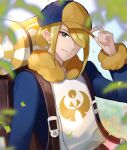  1boy backpack bag bangs blonde_hair blurry brown_bag closed_mouth commentary_request day fur_trim grey_eyes hair_over_one_eye hand_on_headwear hat leaf long_sleeves male_focus orange_headwear outdoors pokemon pokemon_(game) pokemon_legends:_arceus sakuho_sakutomo short_hair smile solo upper_body volo_(pokemon) 