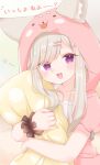  1girl :d animal_ear_fluff animal_ears animare ears_through_headwear fang fox_ears highres hood hood_up hoodie object_hug open_clothes open_hoodie pillow pillow_hug shirochimaki shiromiya_mimi silver_hair single_wrist_cuff smile virtual_youtuber wrist_cuffs 