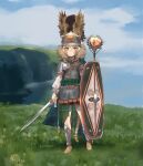  1girl armor asymmetrical_armor bitchcraft123 blonde_hair blurry blurry_background chainmail cloak day full_body greaves green_cloak green_eyes helmet highres holding holding_shield holding_sword holding_weapon original outdoors pauldrons plaid plaid_cloak sandals shield shoulder_armor solo standing sword tail weapon 