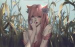  1girl absurdres ahri_(league_of_legends) animal_ears bangs bare_shoulders blurry blurry_background breasts brown_eyes bug butterfly character_request collarbone flower fox_tail hair_flower hair_ornament hand_on_own_face hand_up highres horns league_of_legends long_hair looking_at_viewer lyn_e smile solo tail tattoo vastaya 