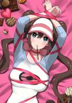  1girl absurdres arms_up bed_sheet blue_eyes blush bound bound_wrists breasts brown_hair candy chocolate cookie double_bun food food_in_mouth hat heart heart-shaped_chocolate highres large_breasts long_sleeves looking_at_viewer lying mouth_hold nishikino_kee on_back pocky poke_ball poke_ball_(basic) poke_ball_print pokemon pokemon_(game) pokemon_bw2 raglan_sleeves red_ribbon ribbon ribbon_bondage rosa_(pokemon) solo sweatdrop twintails upper_body valentine visor_cap 