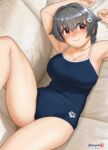  1girl alternate_costume arena_(company) black_hair blue_swimsuit blush breasts cleavage collarbone couch eyebrows_visible_through_hair from_above hair_between_eyes hair_flaps hair_ornament hairclip highres jingei_(kancolle) kantai_collection large_breasts long_hair looking_at_viewer looking_up low_ponytail lying mu-pyon new_school_swimsuit one-piece_swimsuit red_eyes school_swimsuit smile solo swimsuit twitter_username whale_hair_ornament 