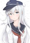  1girl anchor_symbol artist_name black_headwear black_sailor_collar blue_eyes blush closed_mouth collarbone driftkingtw eyebrows_visible_through_hair flat_cap hair_between_eyes hat hibiki_(kancolle) highres kantai_collection long_hair long_sleeves neckerchief red_neckerchief sailor_collar school_uniform serafuku signature silver_hair solo upper_body 