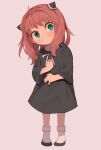  1girl ahoge anya_(spy_x_family) black_dress black_footwear blush child closed_mouth dress full_body green_eyes hairpods head_tilt highres jc_(pixiv_66949345) long_sleeves looking_at_viewer medium_hair pink_hair shoes simple_background socks solo spy_x_family standing white_background white_socks 