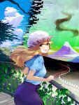  13-gou 1girl blonde_hair blouse blue_blouse collared_blouse commentary_request fence hat leaning_forward looking_at_viewer looking_back maribel_hearn mob_cap mountain neo-traditionalism_of_japan puffy_short_sleeves puffy_sleeves purple_skirt short_sleeves skirt touhou white_headwear yellow_eyes 