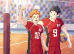  2boys ainudraws ball bangs black_hair blue_eyes haikyuu!! highres hinata_shouyou holding holding_ball japanese_flag kageyama_tobio looking_at_viewer male_focus multiple_boys net olympics open_mouth orange_eyes orange_hair short_hair signature simple_background sportswear volleyball volleyball_net volleyball_uniform 