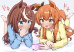  2girls animal_ears blush brown_hair cellphone commentary_request gokurin highres horse_ears horse_girl horse_tail long_hair lying mayano_top_gun_(umamusume) multiple_girls on_stomach orange_eyes orange_hair pajamas phone ponytail sweatdrop tail tokai_teio_(umamusume) umamusume watching 