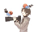  1boy bangs bird black_shirt brown_hair camera closed_eyes commentary_request fletchling from_side grey_jacket hands_up holding holding_camera hood hood_down hooded_jacket jacket long_sleeves male_focus newo_(shinra-p) on_head open_mouth pokemon pokemon_(creature) pokemon_on_head shirt short_hair simple_background smile sweatdrop upper_body white_background 