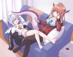  2girls amane_kanata angel angel_wings bangs barefoot black_jacket black_legwear blue_hair blue_shirt blush bow cellphone couch crossed_legs dragon_girl dragon_horns dragon_tail eyebrows_visible_through_hair feathered_wings highres hitsuji_nata holding holding_phone hololive horn_bow horn_ornament horns indoors jacket kiryu_coco long_hair long_sleeves multicolored_hair multiple_girls navel phone pillow pointy_ears red_jacket shirt short_shorts shorts silver_hair sitting sleeping smartphone streaked_hair tail thighhighs virtual_youtuber white_shirt wings 