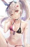  1girl :o ayanami_(azur_lane) azur_lane bandaid bandaid_on_arm bangs bare_arms bare_shoulders bikini breasts brown_hair collarbone commentary_request eyebrows_visible_through_hair front-tie_bikini front-tie_top hair_between_eyes hair_ornament hairclip hand_up head_tilt headgear highres looking_at_viewer natuna_natu navel parted_lips ponytail red_eyes side-tie_bikini small_breasts solo swimsuit 