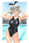  1girl animal_ears blue_eyes blue_swimsuit breasts collarbone competition_swimsuit cowboy_shot day fake_animal_ears gloves hair_ornament hair_over_one_eye hairclip hamakaze_(kancolle) highres kantai_collection large_breasts looking_at_viewer neckerchief one-piece_swimsuit outdoors pool rabbit_ears short_hair silver_hair solo swimsuit wa_(genryusui) water white_gloves yellow_neckerchief 