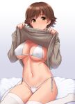  1girl bangs bikini breasts brown_hair brown_sweater clothes_lift eyebrows_visible_through_hair gradient gradient_background grey_background highres honda_mio idolmaster idolmaster_cinderella_girls large_breasts lifted_by_self looking_at_viewer navel short_hair sitting solo sweater sweater_lift swimsuit thighhighs tomajiyama white_bikini white_legwear yellow_eyes 