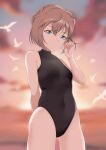  1girl absurdres adjusting_hair arm_behind_back ass_visible_through_thighs bangs bird black_swimsuit blue_eyes blurry blurry_background bob_cut breasts commentary_request covered_navel cowboy_shot haibara_ai hair_tucking hand_up highres hip_bones light_particles looking_at_viewer meitantei_conan one-piece_swimsuit oxygen_mask_(oxygenmask233) seagull short_hair solo swimsuit twilight 