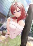  1girl :t bangs bare_shoulders blush breasts closed_mouth day floral_print green_skirt hayaoki_(asagi-iro_seishun-bu) highres holding_own_arm lens_flare long_sleeves looking_at_viewer love_live! love_live!_school_idol_project medium_hair nishikino_maki off-shoulder_shirt off_shoulder outdoors playing_with_own_hair pout shirt skirt solo v-shaped_eyebrows waiting white_shirt 