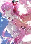  1girl blurry blurry_background breasts closed_mouth detached_sleeves floating_hair hatsune_miku head_tilt headphones headset long_hair long_sleeves looking_at_viewer medium_breasts microphone miniskirt necktie pink_hair pink_necktie pink_skirt pink_sleeves pleated_skirt red_eyes sakura_miku shiny shiny_hair shirt shoulder_tattoo skirt sleeveless sleeveless_shirt smile solo taisa_piyo tattoo vocaloid white_shirt 