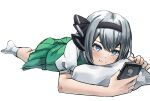  1girl bangs black_bow black_hairband blue_eyes bow cellphone closed_mouth green_skirt green_vest hair_bow hairband highres konpaku_youmu light_blush looking_at_phone lying on_stomach phone pillow puffy_short_sleeves puffy_sleeves ramiki short_hair short_sleeves silver_hair skirt smartphone smile socks solo touhou vest white_background white_legwear 