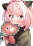  1girl animal_ears bangs black_shirt blurry blush character_request depth_of_field green_eyes highres holding looking_at_viewer medium_hair pink_hair rojineco_nene shirt simple_background soft_focus solo spy_x_family stuffed_animal stuffed_toy white_background 