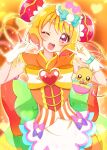  1girl ;d absurdres bangs blonde_hair cure_yum-yum delicious_party_precure eyebrows_visible_through_hair gloves hair_bun hanamichi_ran heart heart_background highres index_finger_raised long_hair looking_at_viewer magical_girl mem-mem_(precure) one_eye_closed orange_background precure red_eyes smile sugimura_mickey white_gloves 