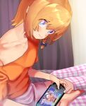  1girl alternate_costume bangs blonde_hair blue_bow blue_eyes blush bow braid bright_pupils closed_mouth collarbone commentary_request cookie_(touhou) eyebrows_visible_through_hair foot_out_of_frame hair_between_eyes hair_bow handheld_game_console hentai_kuso_oyaji highres indian_style kirisame_marisa koiso_usu looking_at_viewer manatsu_no_yo_no_inmu meguru_(cookie) off_shoulder orange_shirt pink_shorts playstation_portable shirt short_hair shorts side_braid single_braid sitting smile solo touhou white_pupils 