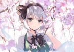  1girl black_bow black_bowtie black_hairband black_ribbon bob_cut bow bowtie branch cherry_blossoms collared_shirt duplicate flower green_eyes green_vest grey_hair hair_ribbon hairband highres ke-ta konpaku_youmu konpaku_youmu_(ghost) looking_at_viewer outdoors petals pink_flower pixel-perfect_duplicate ribbon shirt short_sleeves smile solo touhou tree vest white_shirt 