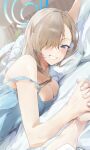  1boy 1girl asuna_(blue_archive) bare_shoulders blue_archive blue_camisole blue_eyes blush breasts camisole cleavage grin hair_over_one_eye highres holding_hands kuu_(user_gngs5284) large_breasts light_brown_hair long_hair looking_at_viewer lying on_stomach pillow smile solo_focus 