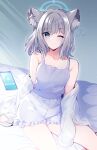  1girl animal_ear_fluff animal_ears blue_archive blue_eyes blush breasts camisole cellphone closed_mouth collarbone feet_out_of_frame frilled_shorts frills grey_hair halo highres long_sleeves looking_at_viewer off_shoulder on_bed one_eye_closed open_clothes open_shirt phone shiroko_(blue_archive) shirt short_hair shorts sitting sleeves_past_wrists smartphone solo squeans sunlight white_camisole white_shirt wolf_ears yozorasiba 