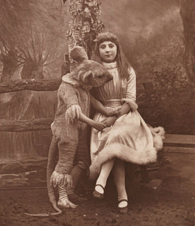 1887 19th_century alice_(alice_in_wonderland) alice_in_wonderland ambiguous_gender ancient_art anthro clothing costume dormouse dormouse_(alice_in_wonderland) ernest_barraud female fursuit human looking_at_viewer mammal monochrome mouse murid murine photography_(artwork) real rodent sepia simple_background
