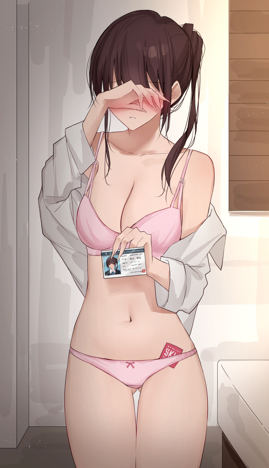1girl ass_visible_through_thighs bangs bed blush bow bow_panties bra breasts brown_hair cleavage collarbone collared_shirt condom condom_wrapper covered_eyes highres hotel_room id_card indoors kanju medium_breasts navel open_clothes open_shirt original panties pink_bow pink_bra pink_panties shirt shirt_slip solo underwear white_shirt