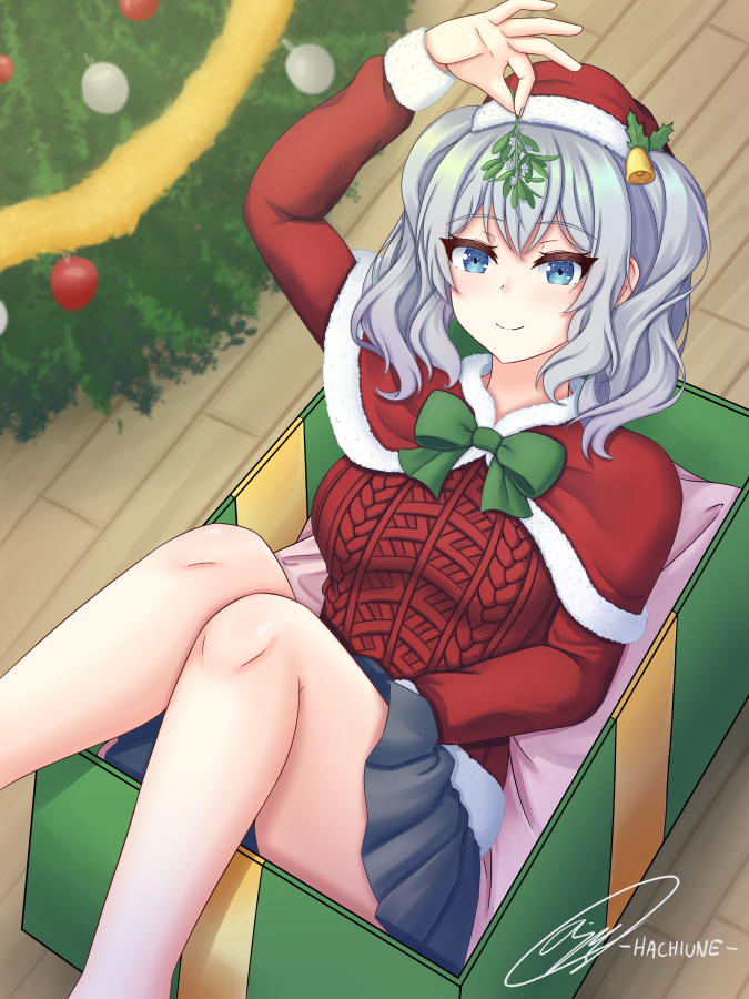 1girl aran_sweater arm_up artist_name bangs bare_legs between_legs black_skirt blue_eyes box cable_knit capelet christmas_sweater christmas_tree closed_mouth flower fur-trimmed_capelet fur-trimmed_headwear fur_trim gift gift_box green_ribbon grey_hair hachiune hand_between_legs hat holding holding_flower holding_mistletoe kantai_collection kashima_(kancolle) long_hair long_sleeves pleated_skirt red_capelet red_sweater ribbon santa_hat signature sitting skirt smile solo sweater twintails wooden_floor