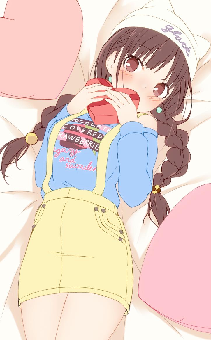 1girl bare_shoulders bed_sheet blue_shirt blush bow box braid breasts brown_hair dot_nose earrings from_above hair_bow hat heart heart-shaped_box heart_pillow holding holding_box idolmaster idolmaster_shiny_colors jewelry large_breasts long_hair long_sleeves looking_at_viewer lying metindone off-shoulder_shirt off_shoulder on_back on_bed pillow print_shirt red_eyes shirt skirt solo sonoda_chiyoko suspender_skirt suspenders twin_braids twintails white_headwear yellow_skirt