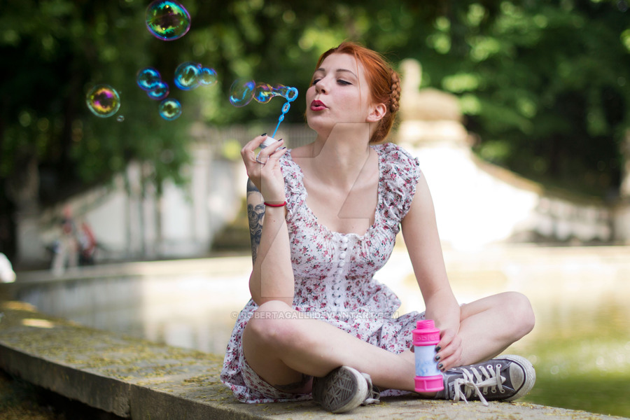1girl cosplay costume dolores_haze_(nabokov's_lolita) photo river shoes sitting sneakers soap_bubble solo tagme