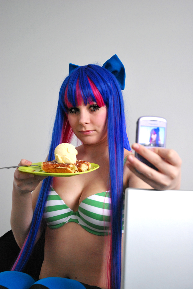 blue_hair bra breasts candy cellphone cleavage cosplay food large_breasts long_hair makeup midriff multicolored_hair panty_&amp;_stocking_with_garterbelt phone photo pink_hair real stocking_(character) stocking_(psg) underwear