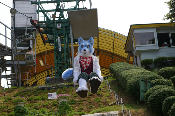 blue clothing fur fursuit headband japan lift looking_at_viewer outside photo real sitting solo