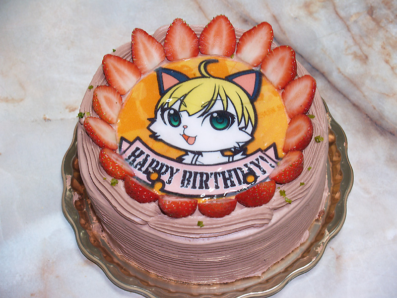 ahoge animal_ears birthday blonde_hair cake cat cat_ears english food fruit furry green_eyes looking_at_viewer no_humans open_mouth photo plate real short_hair smile strawberry sumomo_kpa