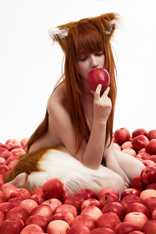 1girl anastasiya_reznikova animal_ears apple cosplay eating eyes_closed female food fruit holo holo_(cosplay) horo horo_(cosplay) long_hair naked nude photo real red_hair simple_background solo spice_and_wolf tail