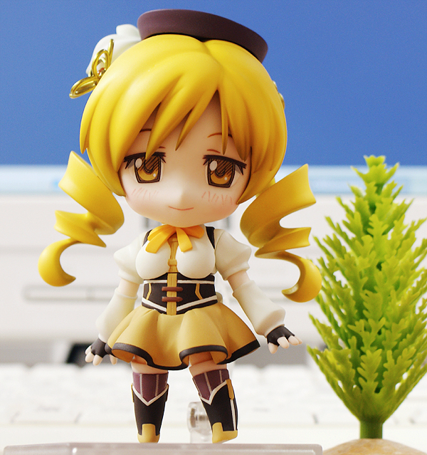 blonde_hair boots bow bowtie brown_eyes detached_sleeves drill_hair female figure fingerless_gloves gloves hat mahou_shoujo_madoka_magica nendoroid photo shirt skirt smile solo standing tomoe_mami tree white_shirt yellow_eyes